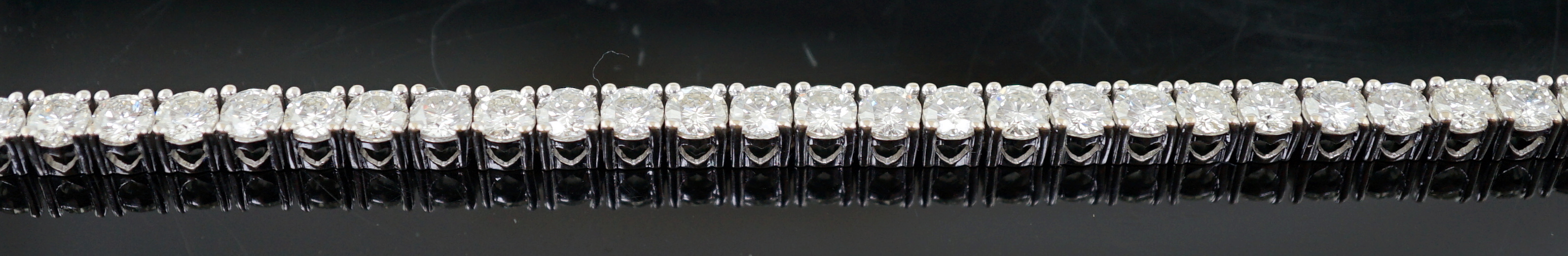 An 18k white gold and diamond line bracelet